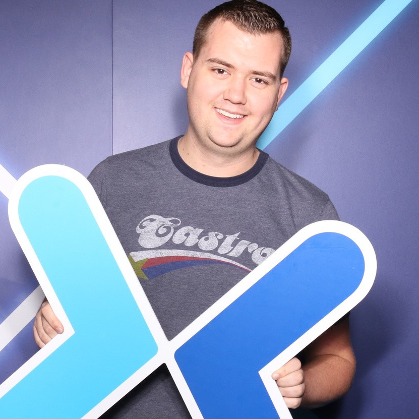 heyaapl holding a giant X sign at PAX